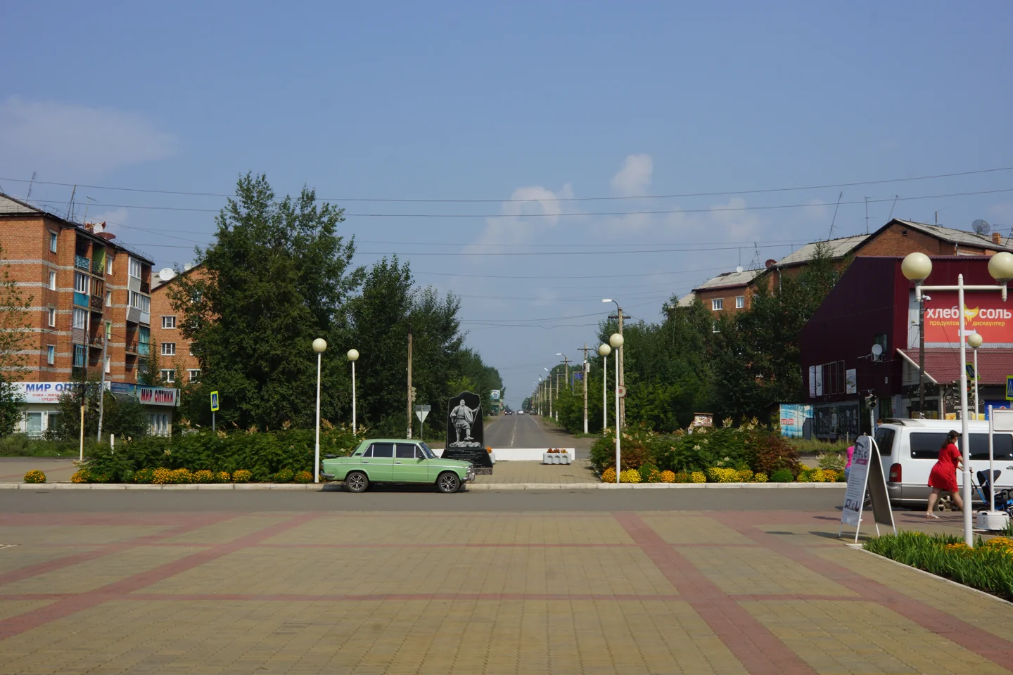 13 August 2020. Looking from the station square towards Lenin Street. Vikhorevka is a town within Bratsk District; the photograph shows its modern urban setting.